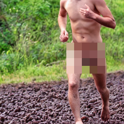 A naked runner, whose head is out of frame, running on a floor of poop.